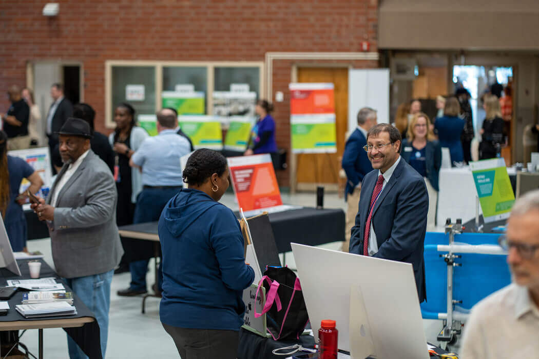 Attendees meeting and talking at conference