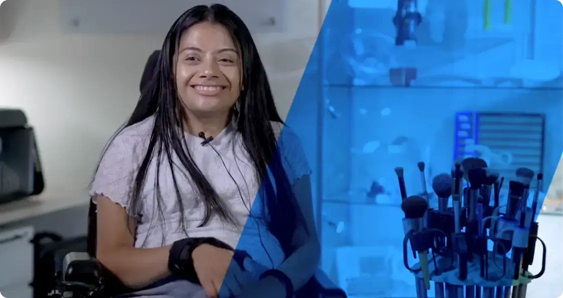 Young woman smiling and sitting in a wheelchair